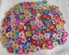 Gambar Assorted Handmade Crochet Mini Flowers a Set of 100 pcs- Random Colors